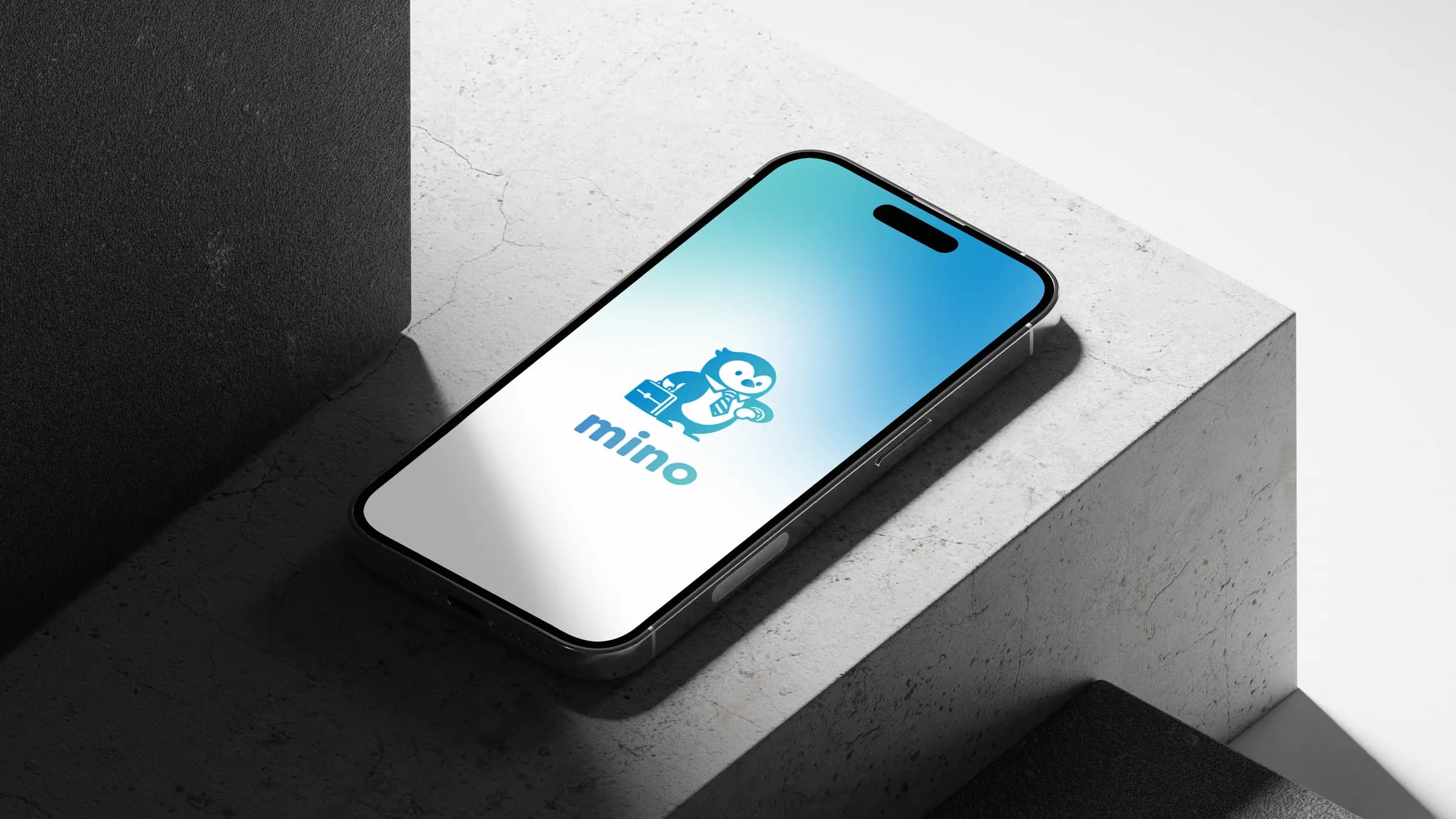 The mino splash screen on an iPhone resting on concrete blocks