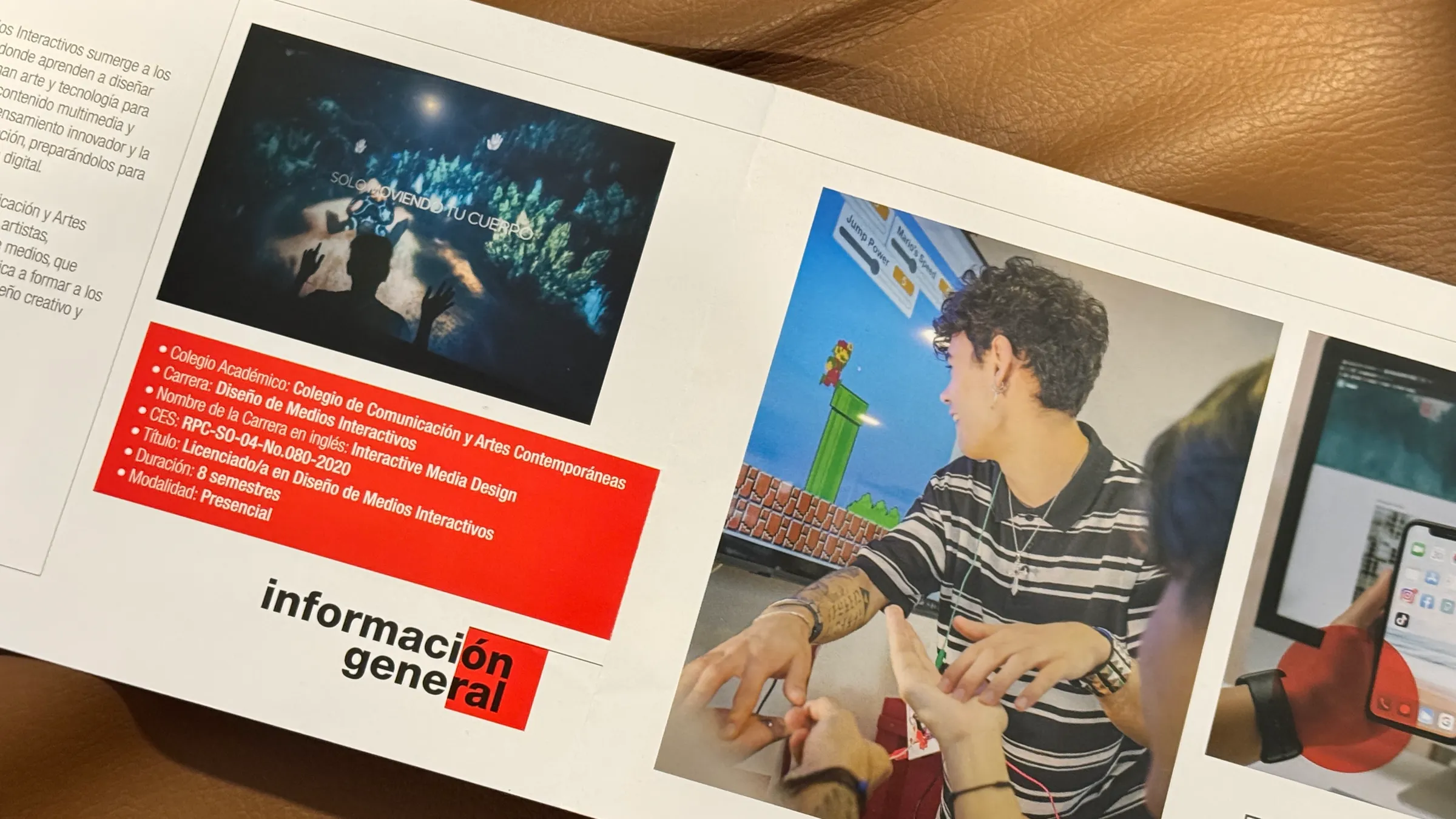 A printed brochure for USFQ's Interactive Media Design program, showing screenshots from A Través del Iris