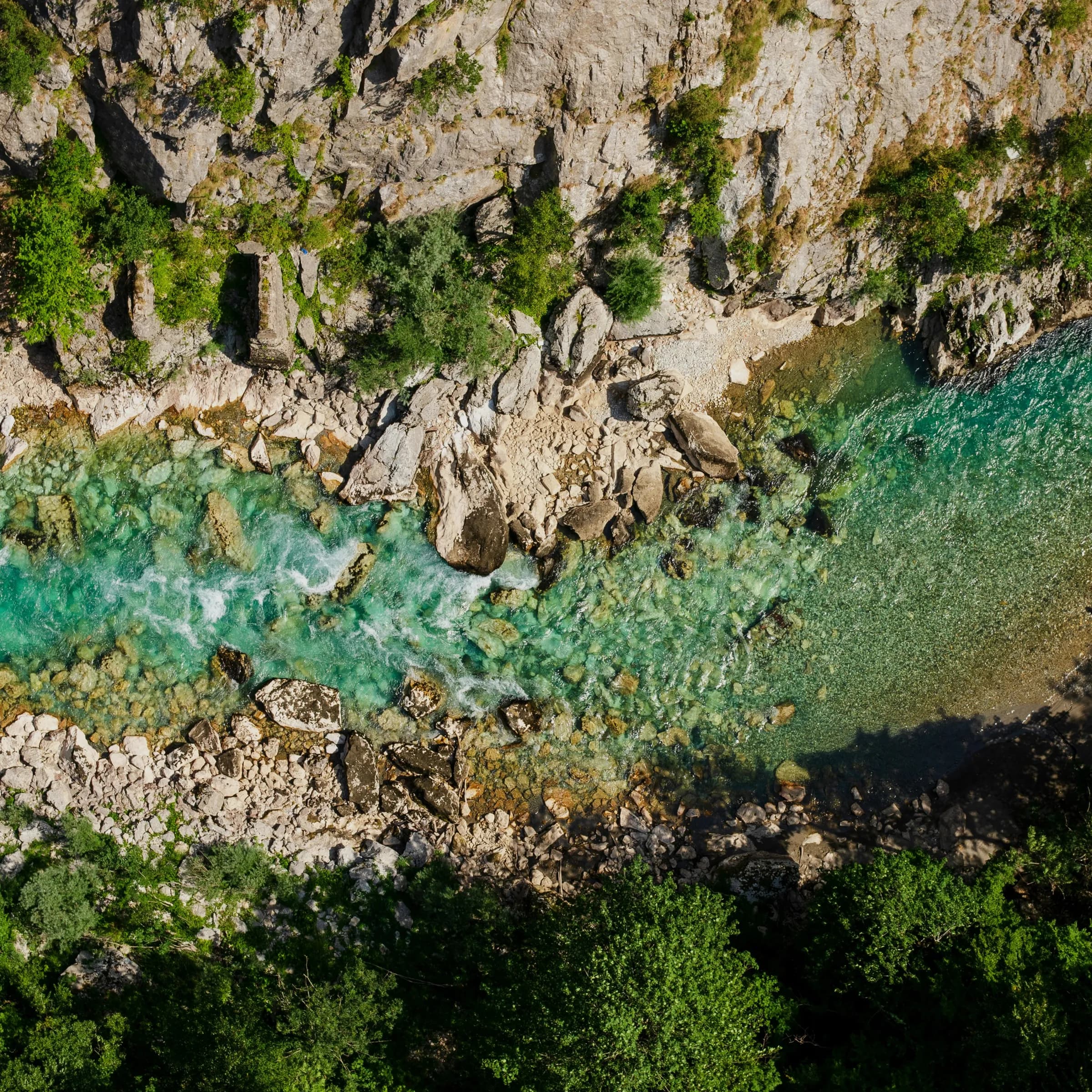 The Machángara river from above, turquoise water cutting through the canyon rock